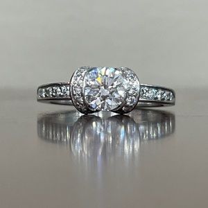 Tiffany and Co Ribbon Diamond Solitaire Ring in Platinum, Size 6